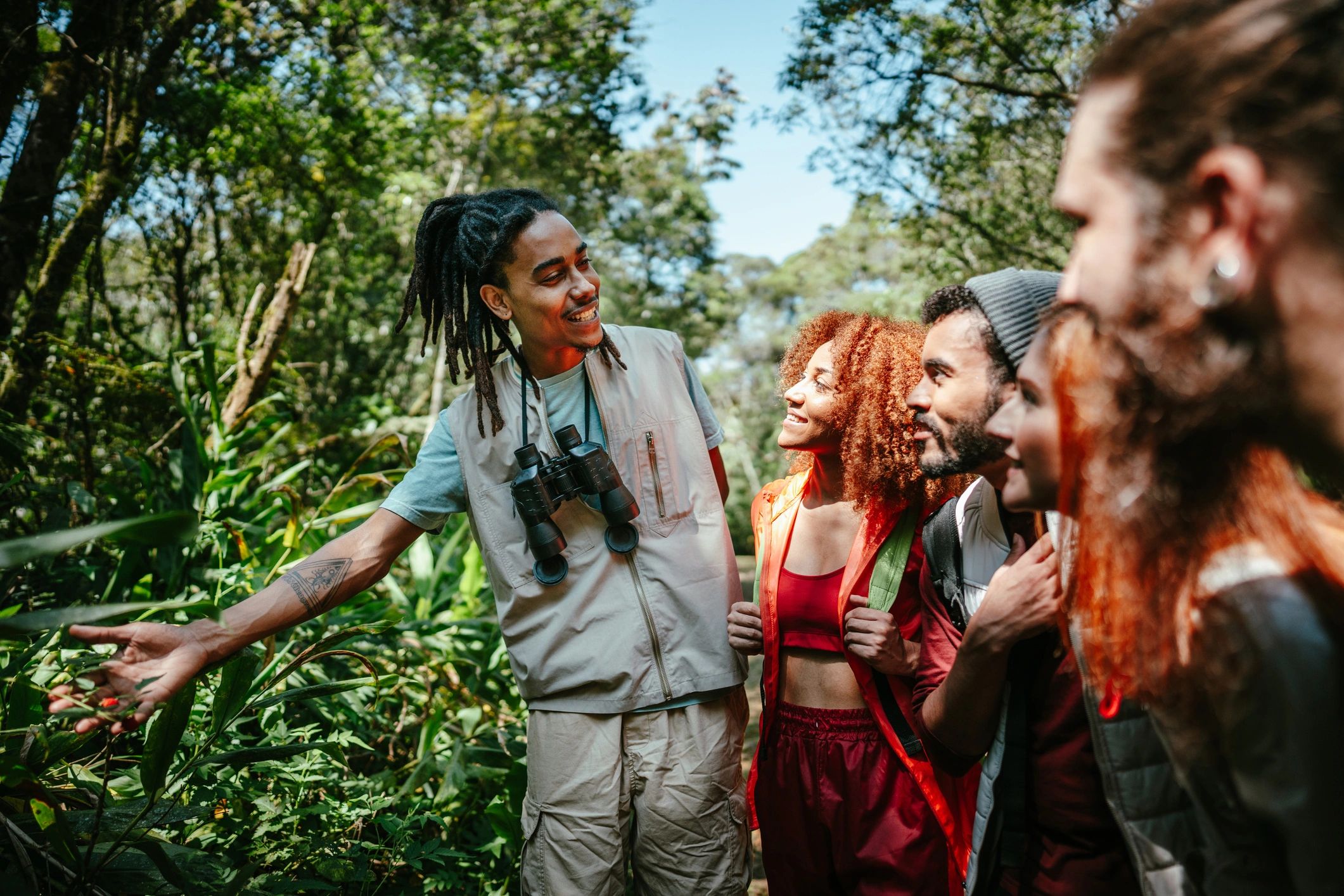 Tour guide assisting travelers outdoors