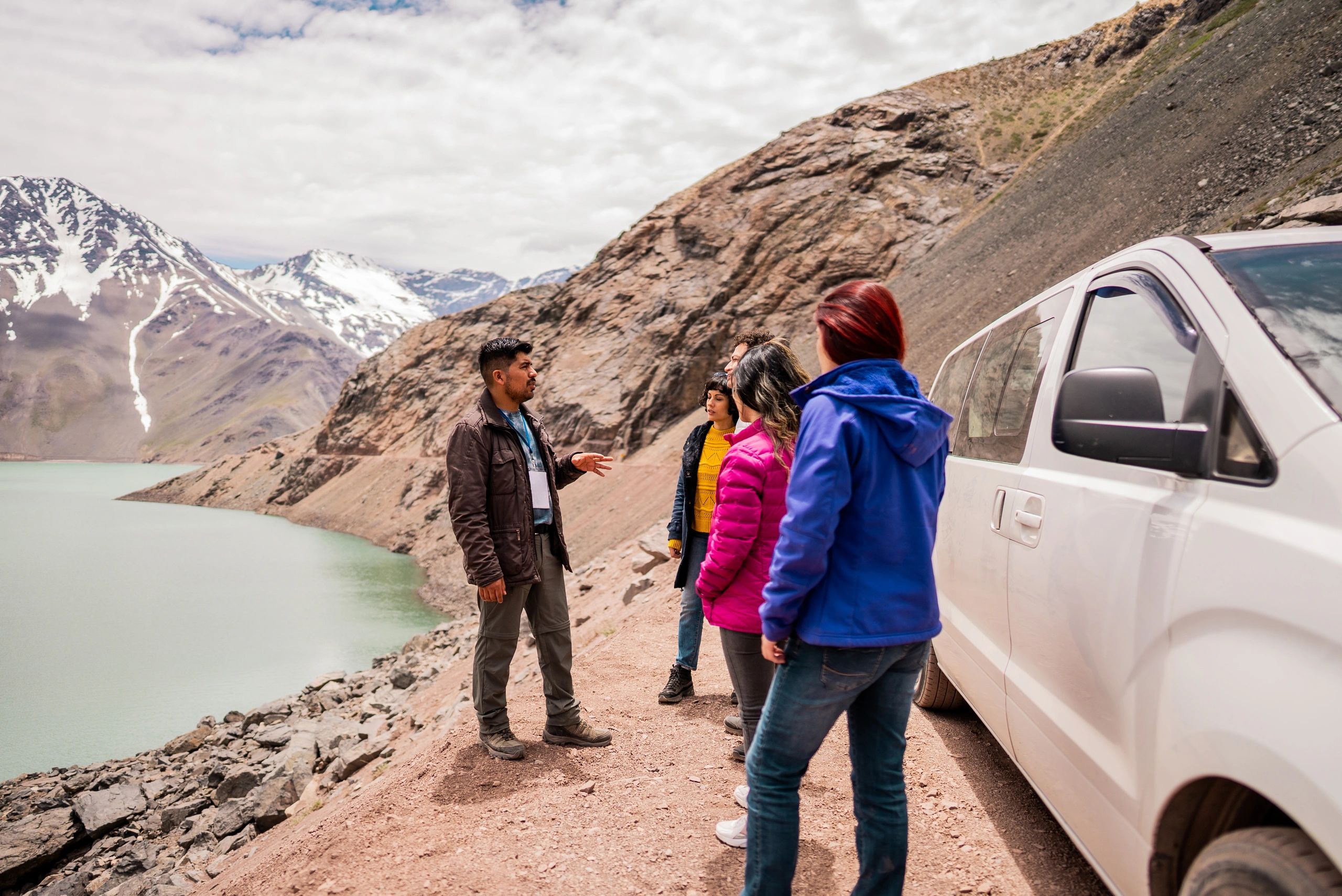 Travelers with a guide in the mountains