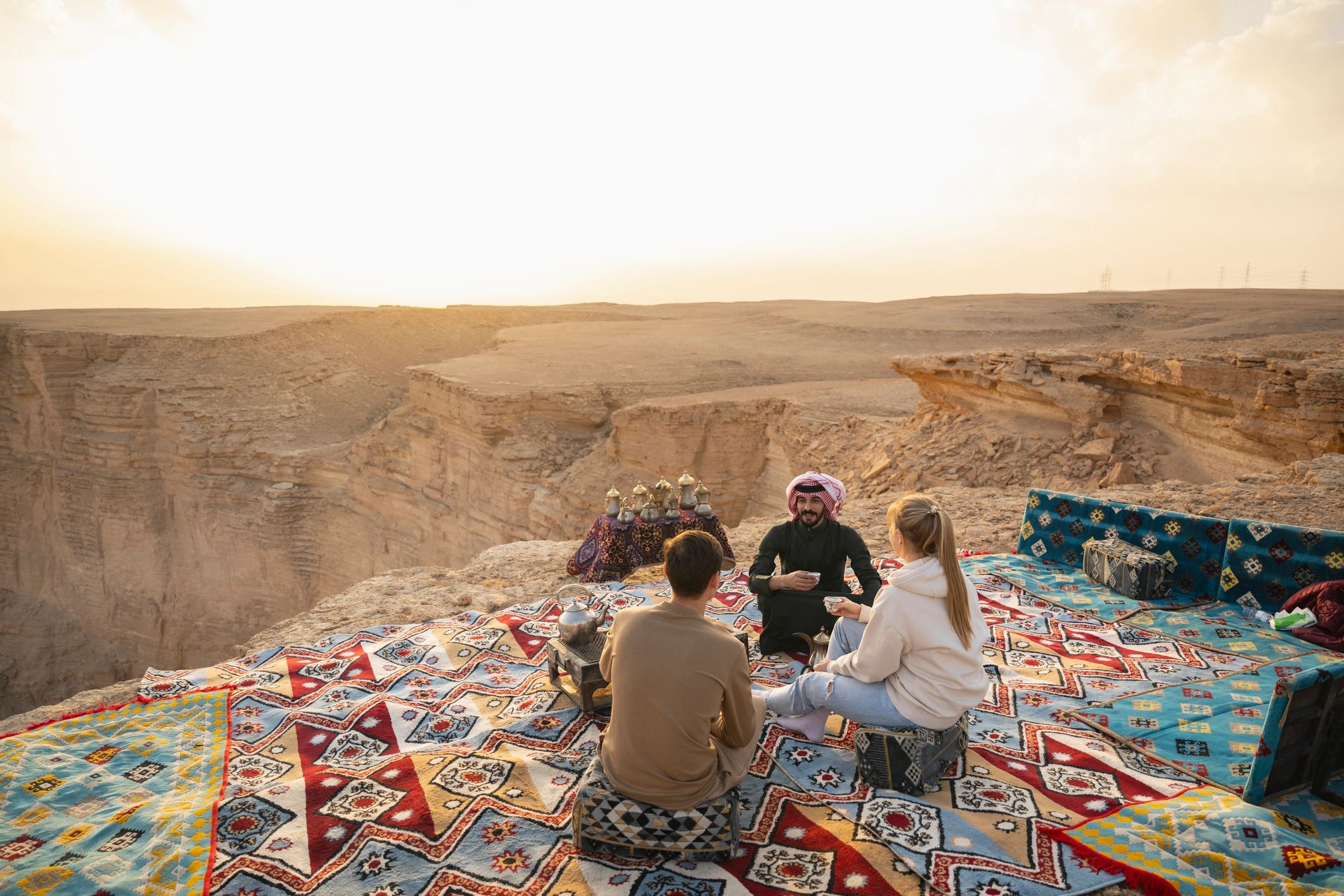 Travelers relaxing with a guide in a scenic setting