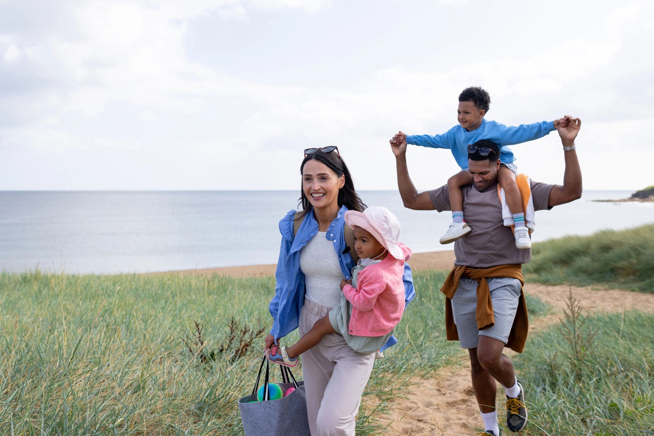 Family walking near the beach on vacation
