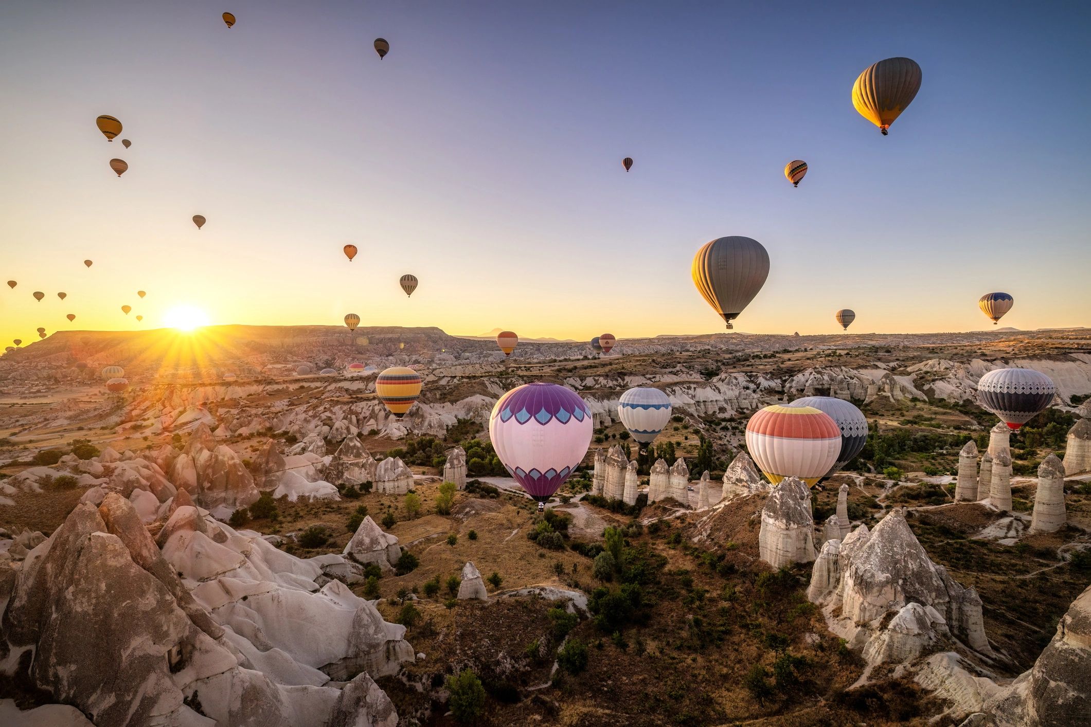 Hot air balloons over Cappadocia destination landscape